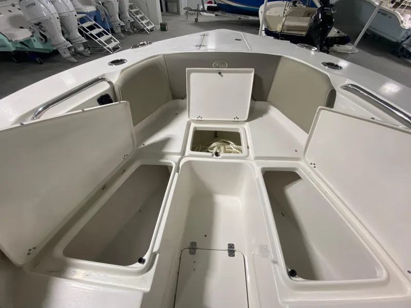 Slide: The Image of 2024 Key West 263 FS boat with open storage compartments. - 30