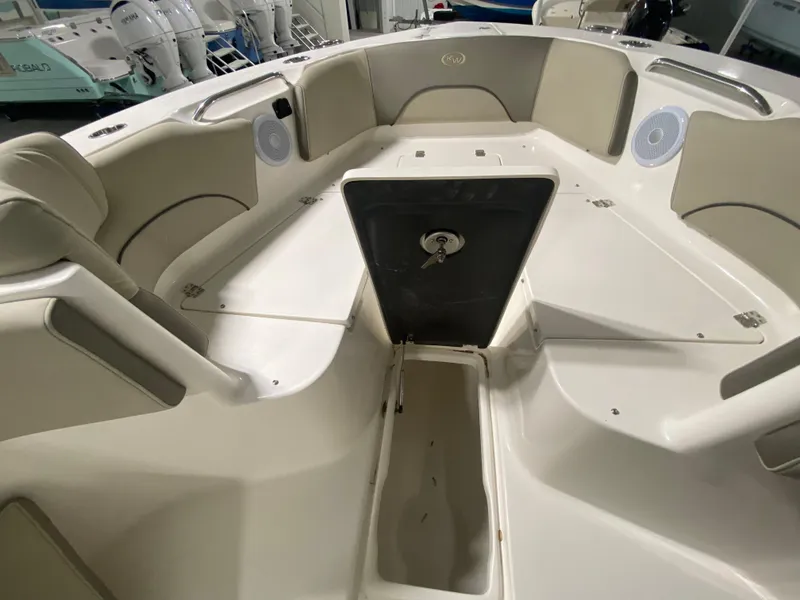 Slide: The Image of 2024 Key West 263 FS boat interior with seating and storage compartments. - 31