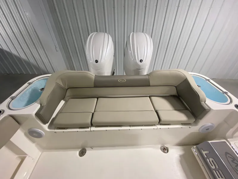 Slide: The Image of 2024 Key West 263 FS boat with dual outboard motors and cushioned seating. - 5
