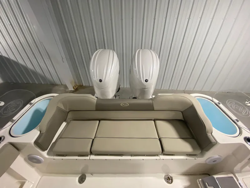 Slide: The Image of 2024 Key West 263 FS boat with twin engines and cushioned seating. - 6
