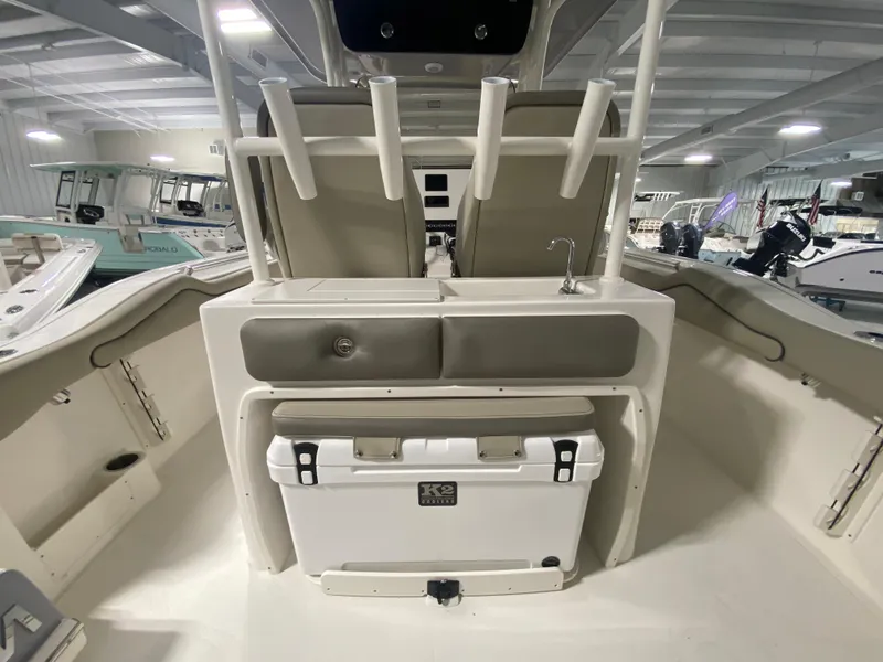 Slide: The Image of 2024 Key West 263 FS boat interior with cooler and storage compartments. - 9