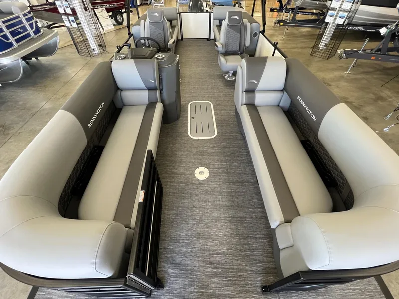 Slide: The Image of 2024 Bennington S Line pontoon boat interior with gray seating and modern design. - 3