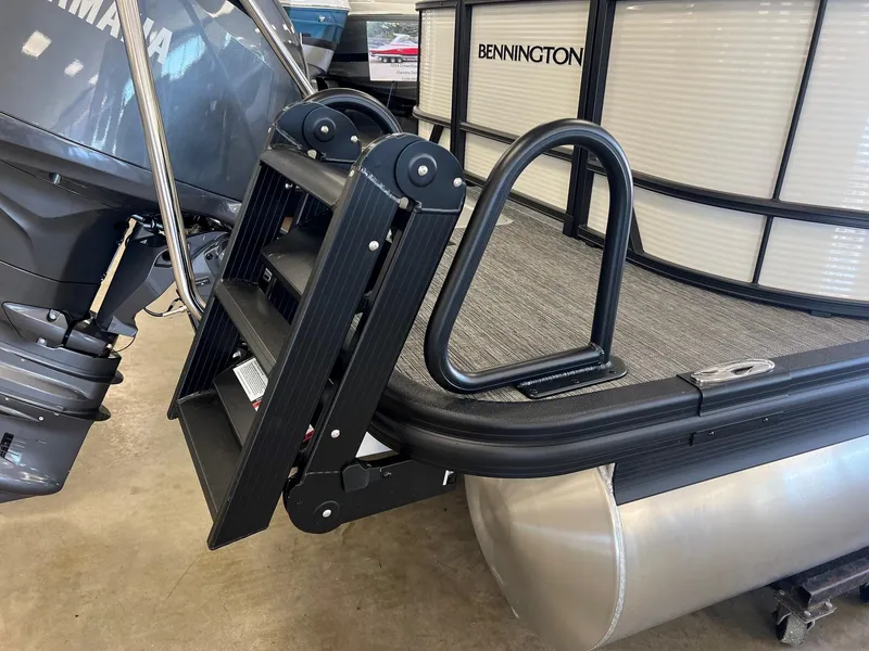 Slide: The Image of 2024 Bennington S Line pontoon boat with Yamaha motor and boarding ladder. - 7