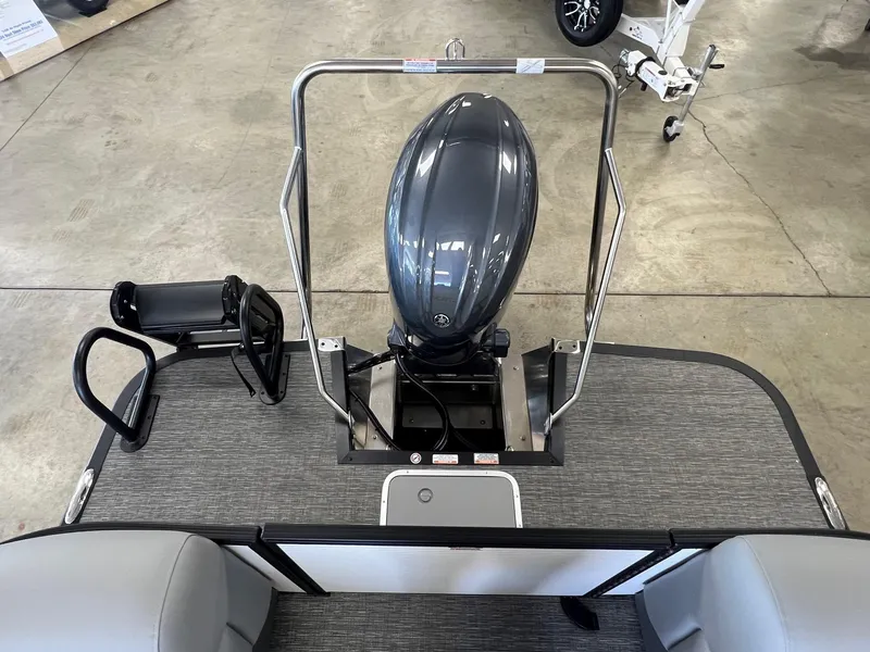 Slide: The Image of 2024 Bennington S Line boat with outboard motor on display in showroom. - 8