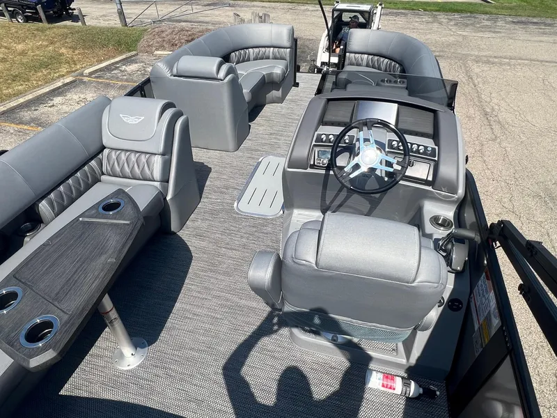 Slide: The Image of 2024 Bennington LX Sport Line boat interior with luxurious seating and modern dashboard. - 4