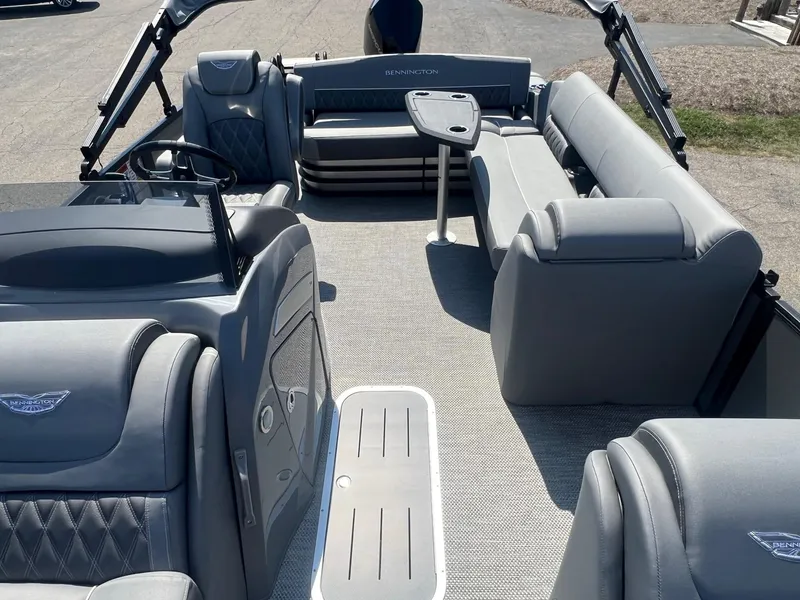 Slide: The Image of 2024 Bennington LX Sport Line boat interior with luxurious gray seating and modern design. - 5