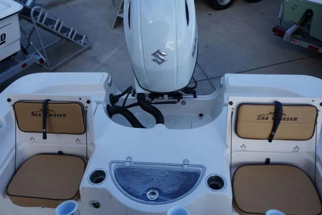 Slide: The Image of 2024 Sea Chaser 21 LX boat stern with Suzuki outboard motor and seating. - 11