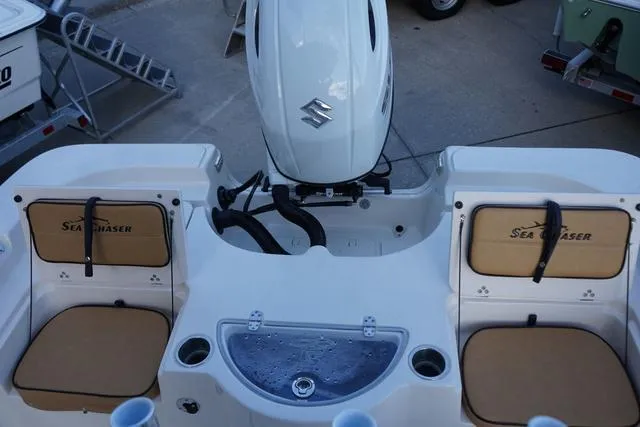 Slide: The Image of 2024 Sea Chaser 21 LX boat with Suzuki outboard motor and seating. - 4