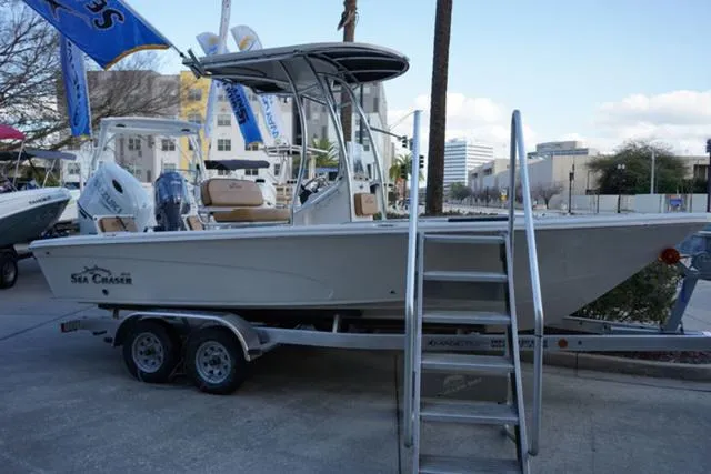 Slide: The Image of 2024 Sea Chaser 21 LX boat on trailer, displayed outdoors. - 8