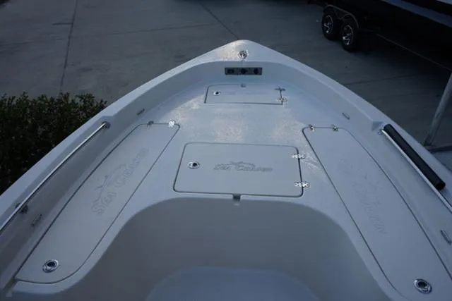 Slide: The Image of 2024 Sea Chaser 21 LX boat deck with storage compartments. - 9