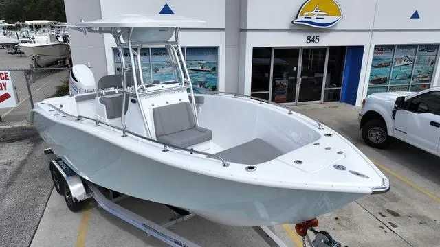 Slide: The Image of 2024 Cape Horn 22OS boat on trailer outside dealership. - 1