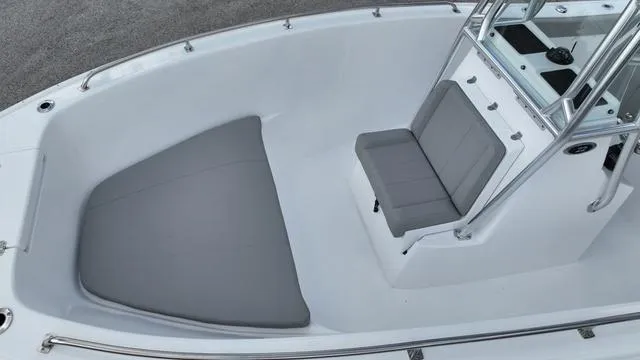Slide: The Image of 2024 Cape Horn 22OS boat interior with gray seating and console. - 12