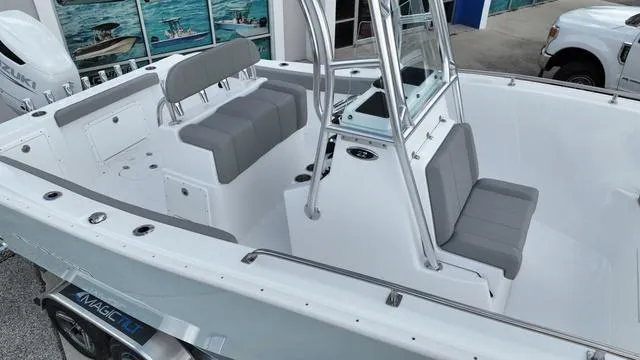 Slide: The Image of 2024 Cape Horn 22OS boat interior with seating and console. - 14