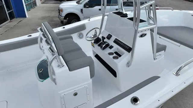 Slide: The Image of 2024 Cape Horn 22OS boat interior with console and seating. - 15