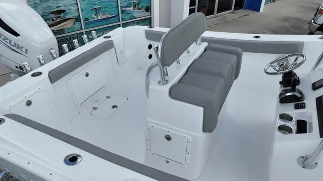 Slide: The Image of 2024 Cape Horn 22OS boat interior with seating and control console. - 16