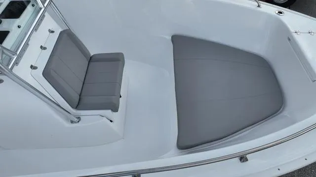 Slide: The Image of 2024 Cape Horn 22OS boat interior with gray cushioned seating. - 17
