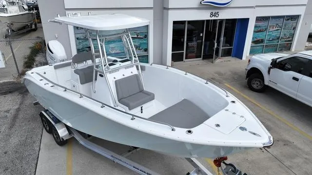 Slide: The Image of 2024 Cape Horn 22OS boat on trailer outside dealership. - 2