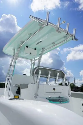 Slide: The Image of 2024 Cape Horn 22OS boat with T-top under a blue sky. - 29