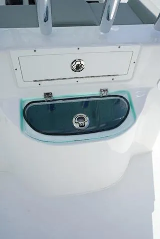 Slide: The Image of 2024 Cape Horn 22OS boat console with storage compartment and livewell. - 34