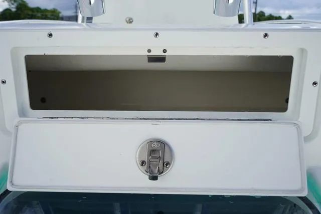 Slide: The Image of 2024 Cape Horn 22OS storage compartment with latch. - 36