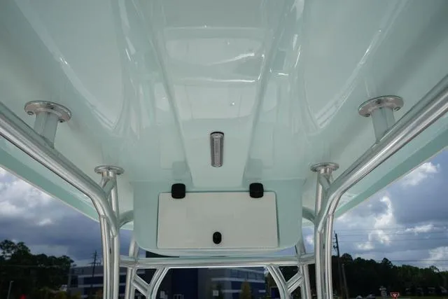 Slide: The Image of 2024 Cape Horn 22OS boat T-top with rod holders and storage compartment. - 44