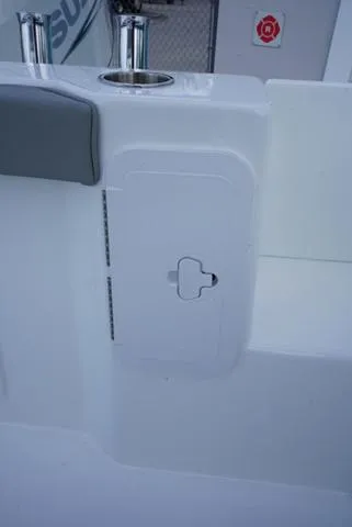 Slide: The Image of 2024 Cape Horn 22OS boat interior detail with storage compartment. - 46