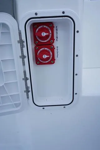 Slide: The Image of Battery switches in the engine house of a 2024 Cape Horn 22OS boat. - 47