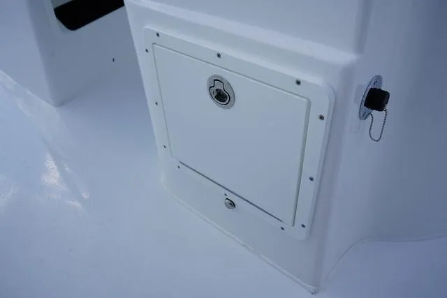 Slide: The Image of 2024 Cape Horn 22OS boat storage compartment with lock. - 48