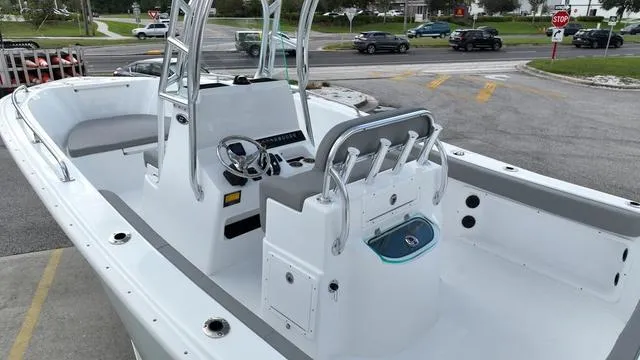 Slide: The Image of 2024 Cape Horn 22OS boat interior with console and seating. - 7