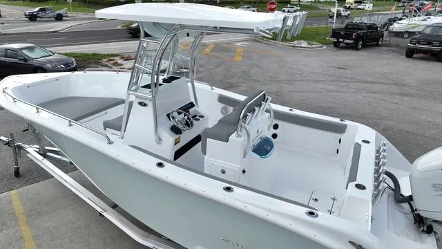 Slide: The Image of 2024 Cape Horn 22OS boat, center console, white exterior, parked on a trailer. - 8