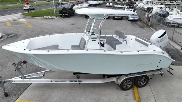 Slide: The Image of 2024 Cape Horn 22OS boat on trailer in dealership lot. - 9