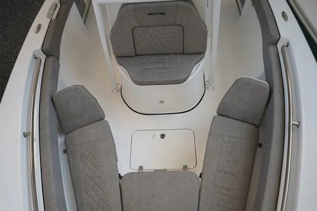 Slide: The Image of 2024 Sea Pro 222 CC boat interior with cushioned seating. - 10