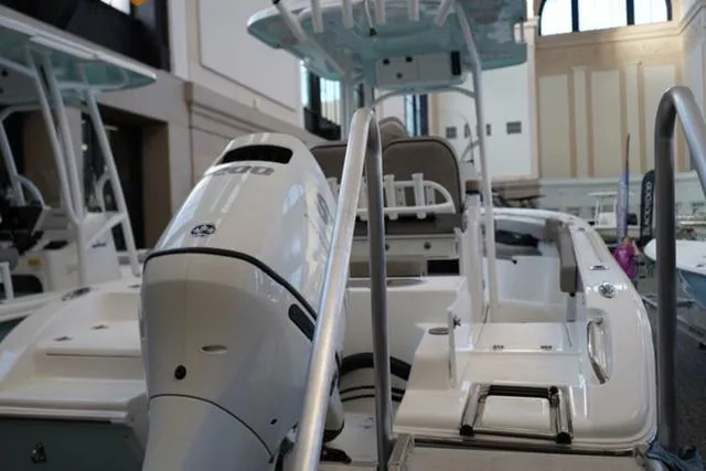 Slide: The Image of 2024 Sea Pro 222 CC center console boat with outboard motor in showroom. - 15