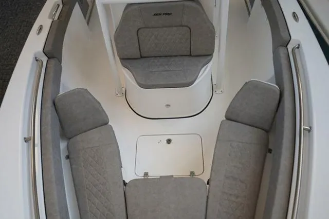 Slide: The Image of 2024 Sea Pro 222 CC boat interior with cushioned seating and storage. - 23