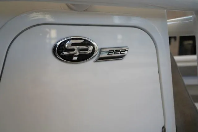 Slide: The Image of 2024 Sea Pro 222 CC boat emblem on white surface. - 25