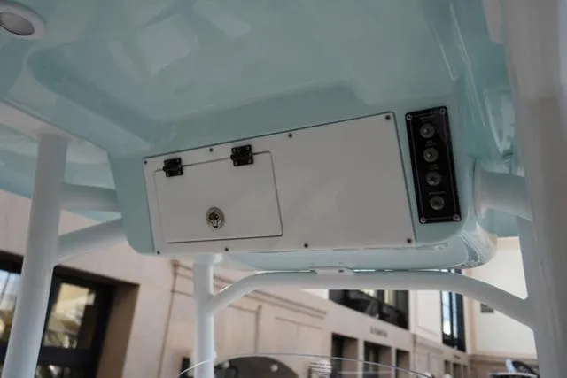 Slide: The Image of 2024 Sea Pro 222 CC boat console storage and control panel. - 26