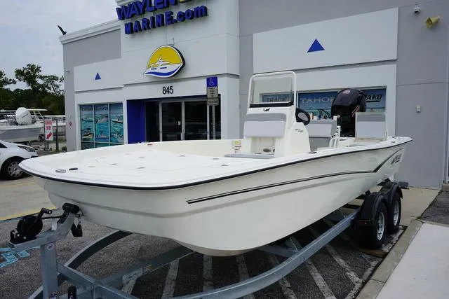 Slide: The Image of 2023 Mako 19 Pro Skiff boat on trailer outside Waylen Marine dealership. - 24