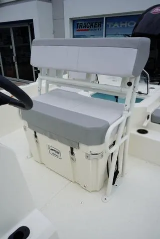 Slide: The Image of 2023 Mako 19 Pro Skiff boat with cushioned seating and storage. - 38