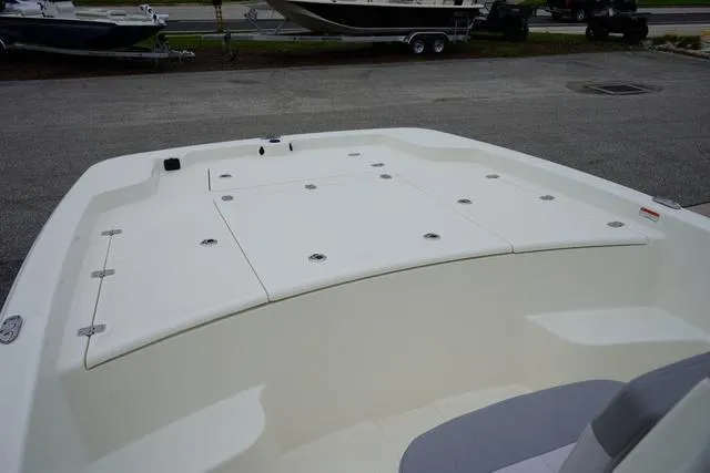 Slide: The Image of 2023 Mako 19 Pro Skiff boat deck with storage compartments. - 43