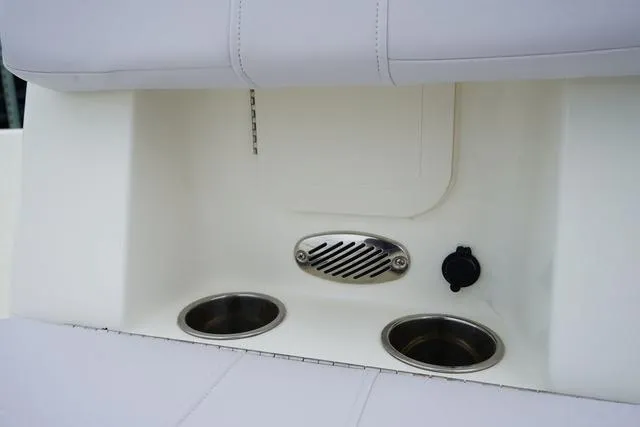 Slide: The Image of 2023 Mako 19 Pro Skiff boat interior with cup holders and speaker. - 46