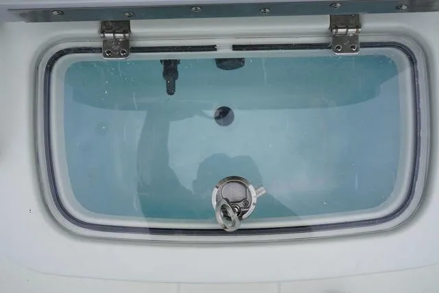 Slide: The Image of Livewell on a 2023 Mako 19 Pro Skiff boat. - 48