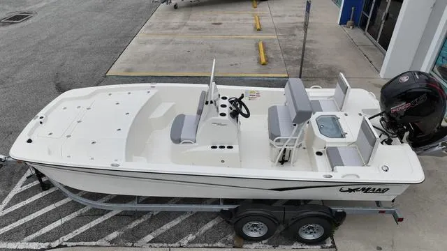 Slide: The Image of 2023 Mako 19 Pro Skiff boat on trailer, top view. - 6