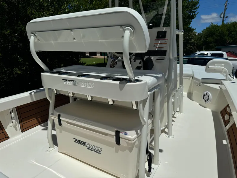 Slide: The Image of 2025 Pathfinder 2200 TRS boat interior with seating and cooler. - 8