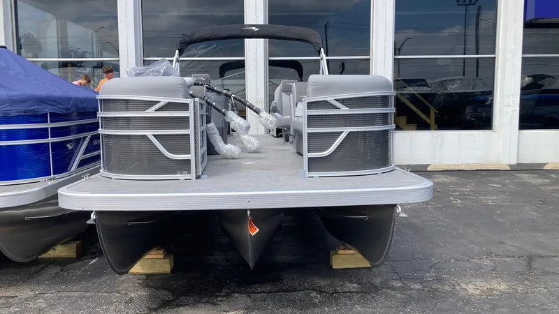 Slide: The Image of 2024 Bennington 22 SVSR pontoon boat displayed outdoors. - 1