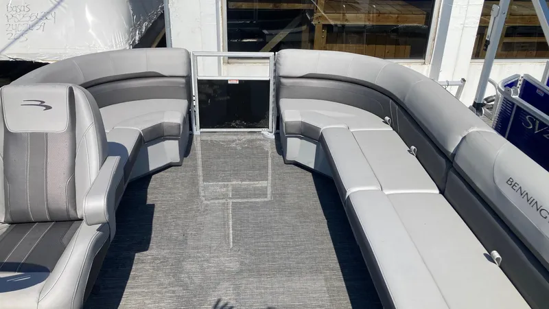 Slide: The Image of 2024 Bennington 21 SXSRC pontoon boat with spacious seating and modern design. - 1