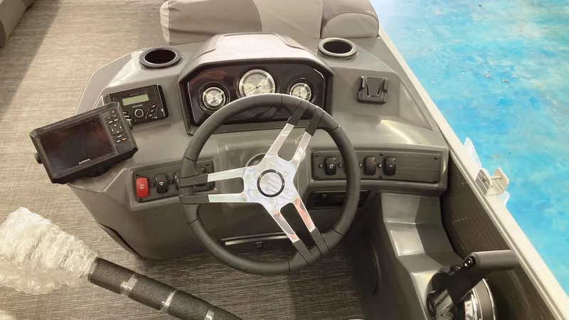 Slide: The Image of 2024 Bennington 20 SVL boat dashboard with steering wheel and control panel. - 4