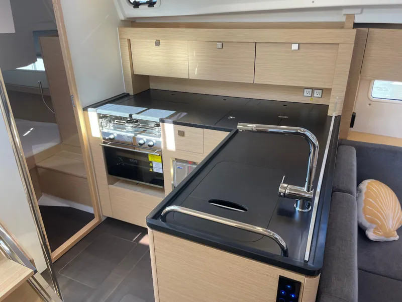 Slide: The Image of Modern kitchen interior of 2024 Hanse 410 yacht with sleek cabinetry and appliances. - 19