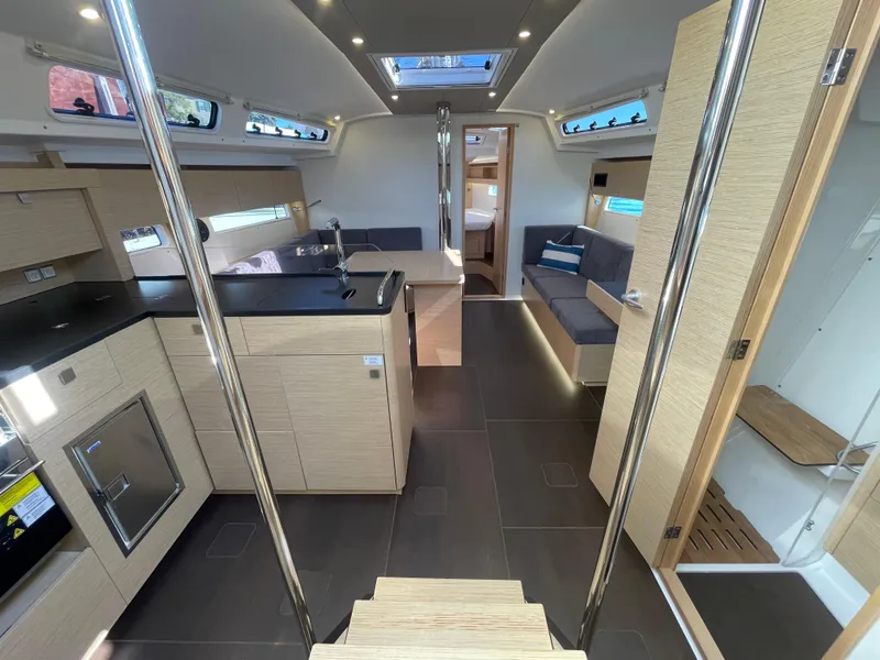 Slide: The Image of Modern interior of 2024 Hanse 410 yacht with sleek kitchen and cozy seating area. - 23