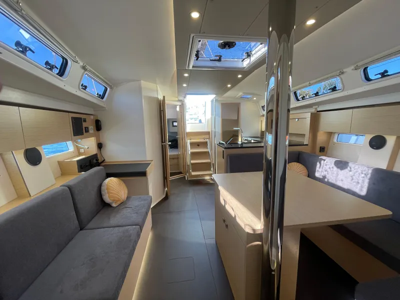 Slide: The Image of Luxurious interior of 2024 Hanse 410 yacht with modern furnishings and ample natural light. - 24