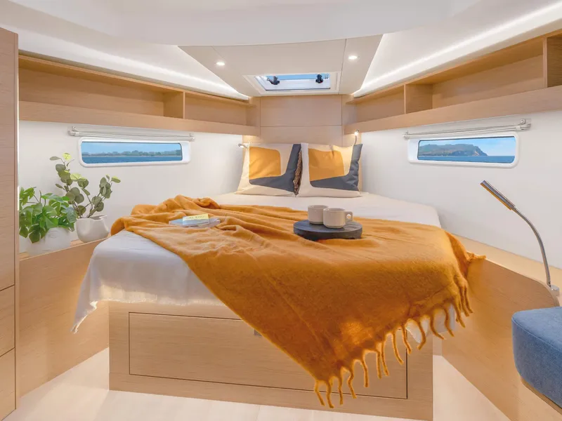 Slide: The Image of Luxurious bedroom interior of 2024 Hanse 410 yacht with cozy bedding and modern decor. - 8